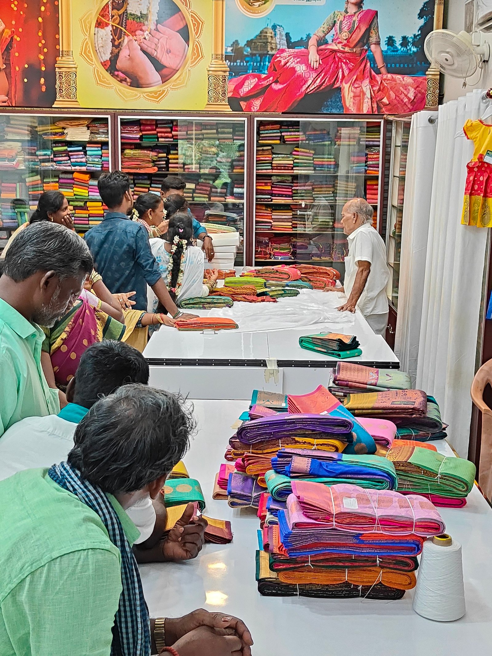 Customers viewing sarees at the Ramalingaa Silk House showroom